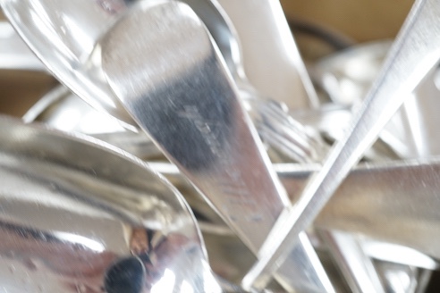 A quantity of assorted 18th century and later silver flatware various dates, makers and patterns, including table spoons, table forks, dessert forks teaspoons, butter knife etc. and an 800 teaspoon